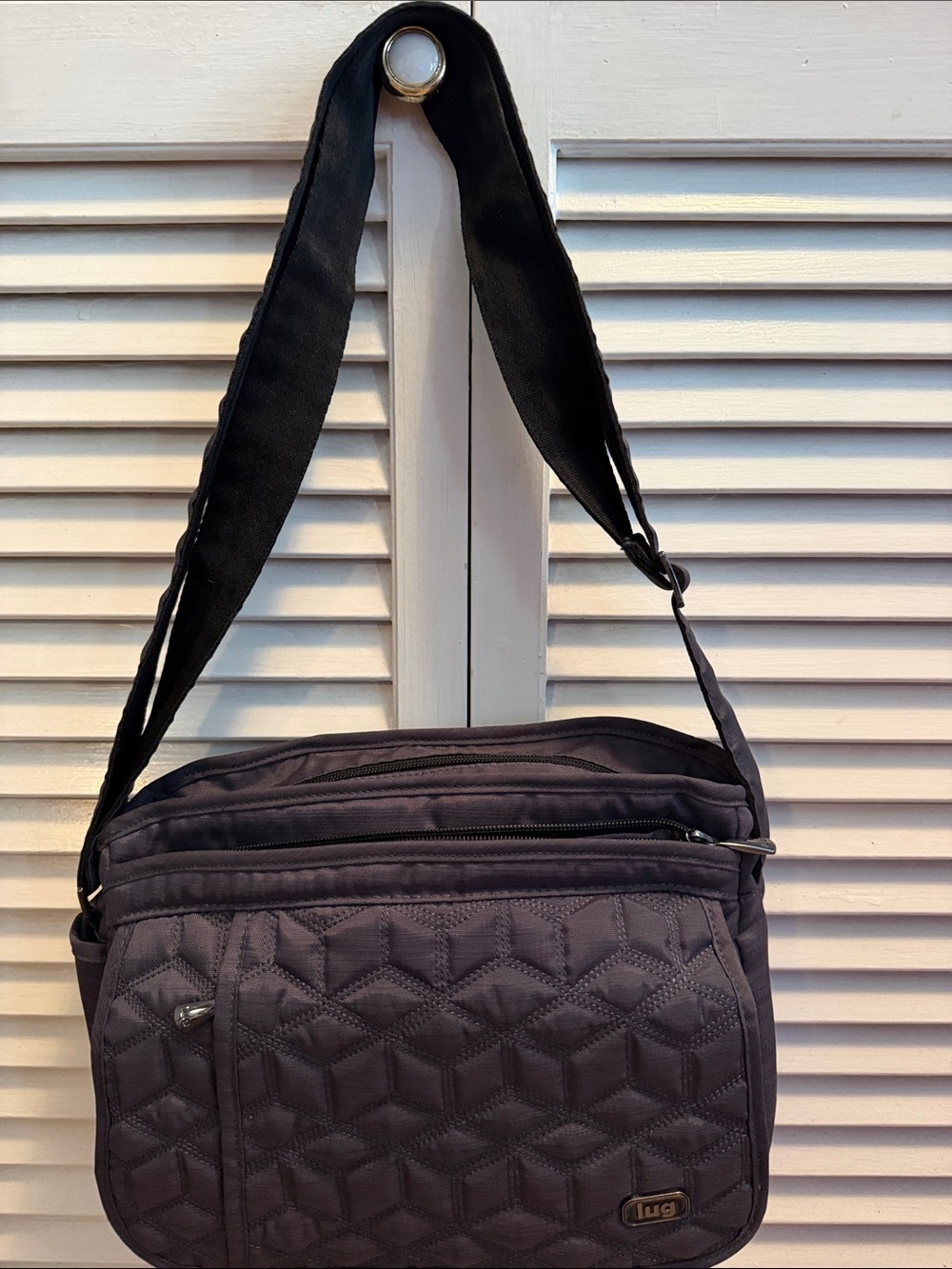 Lug Quilted Messenger Crossbody Bag in Black